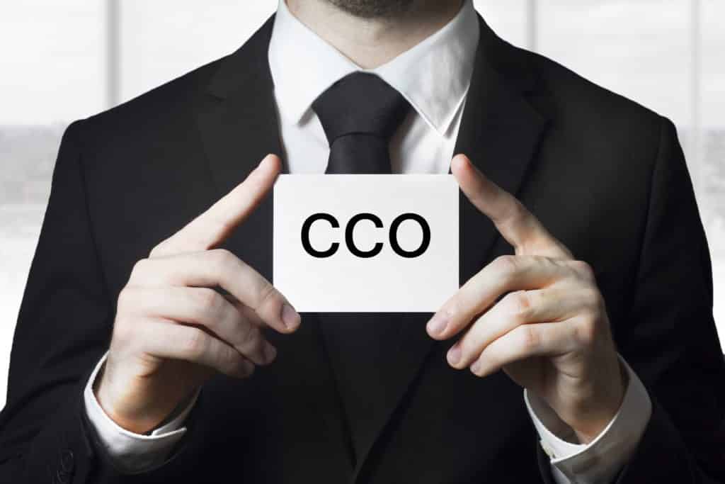 businessman holding small white sign cco